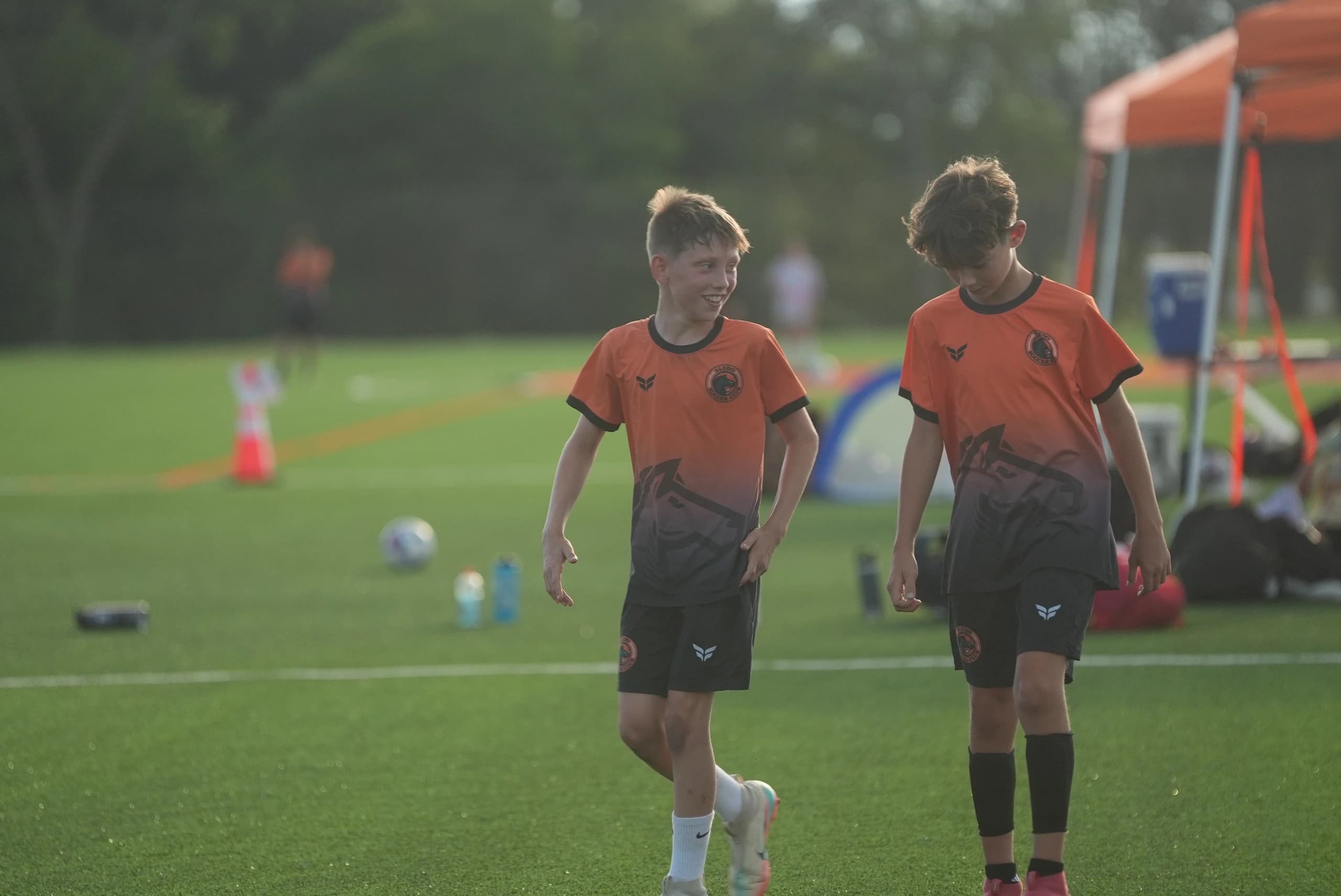 An Aledo Soccer Club coach working with players at The Stable
